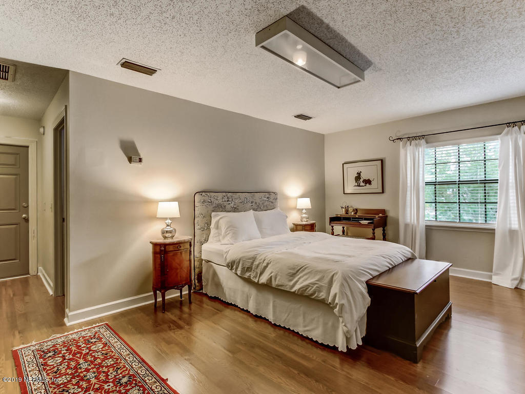 1036 Elder Lane Jacksonville, FL 32207 - Photo 68 of 79 a bedroom with a bed and a window