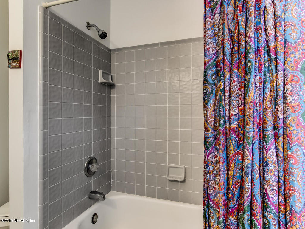 1036 Elder Lane Jacksonville, FL 32207 - Photo 70 of 79 a bathroom with a shower and a bathtub