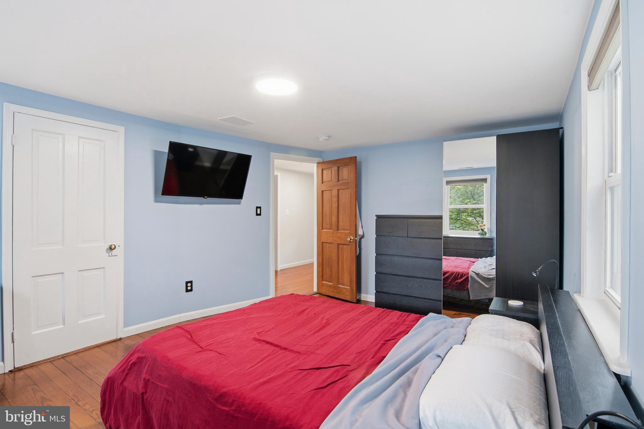 18708 York Road Parkton, MD 21120 - Photo 46 of 59 a bedroom with a bed and a flat screen tv