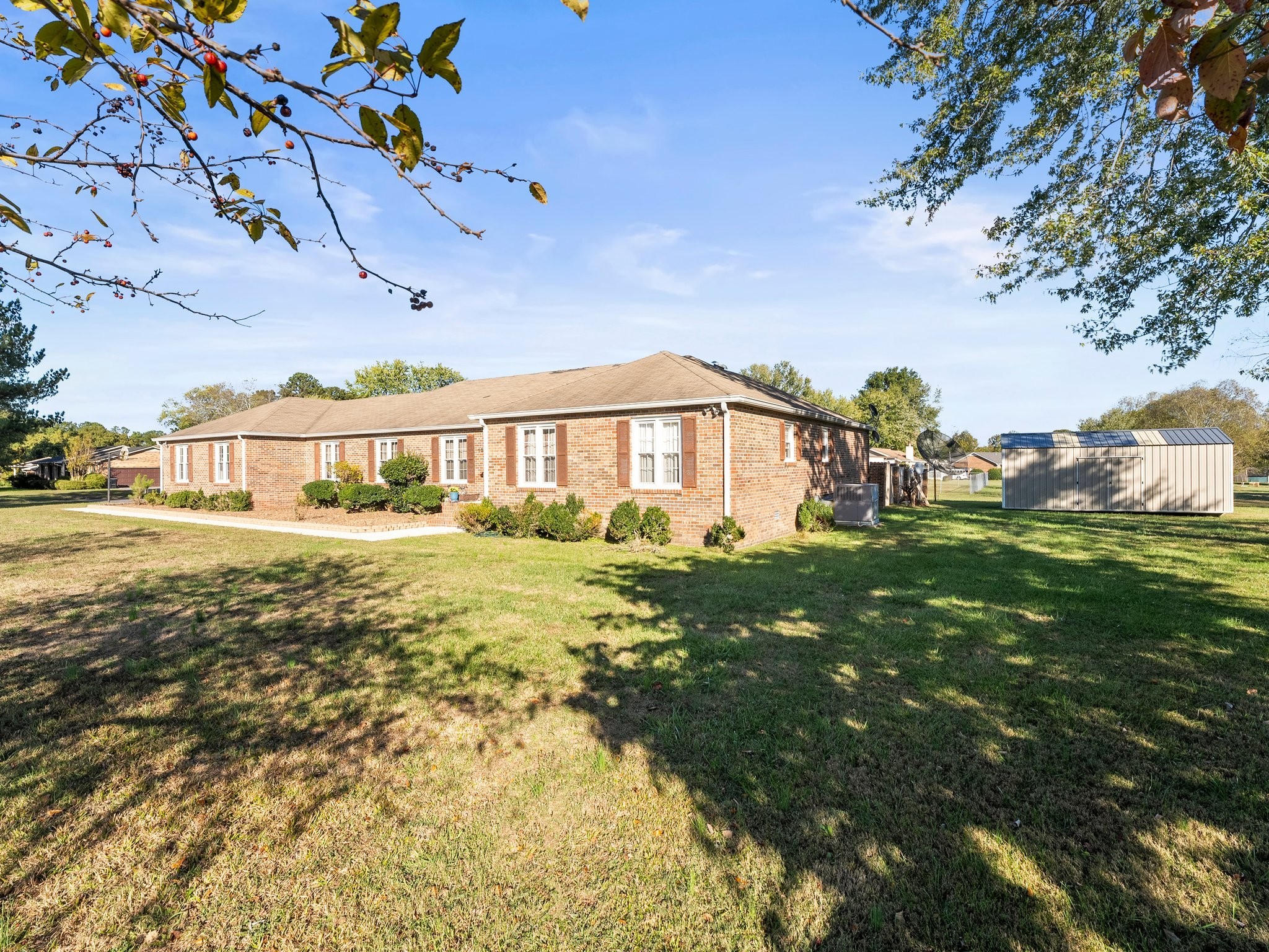 104 12 Oaks Road Tullahoma, TN 37388 - Photo 3 of 41 a view of a big yard with potted plants and large trees