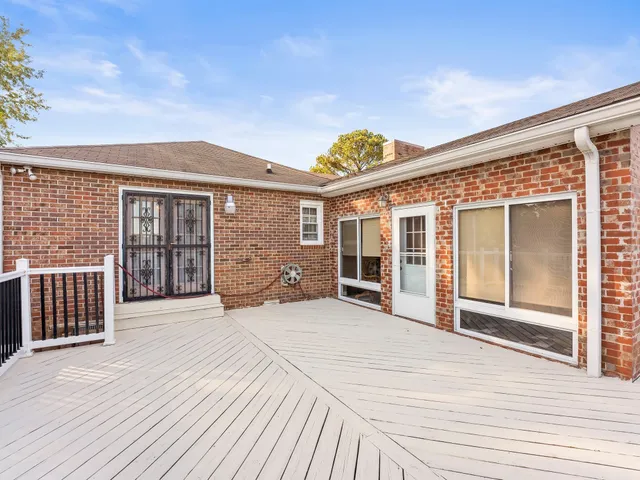 a view of a balcony with wooden floor