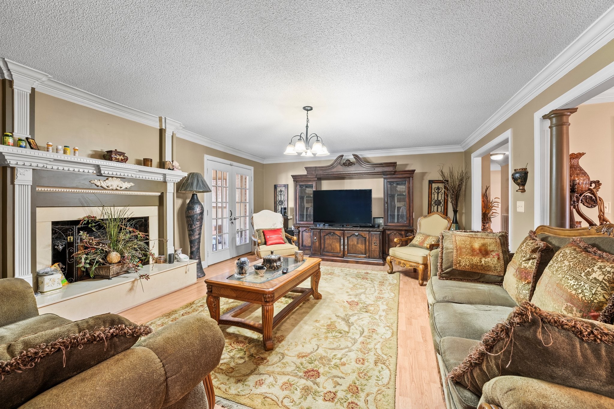 104 12 Oaks Road Tullahoma, TN 37388 - Photo 10 of 41 a living room with furniture a fireplace and a flat screen tv