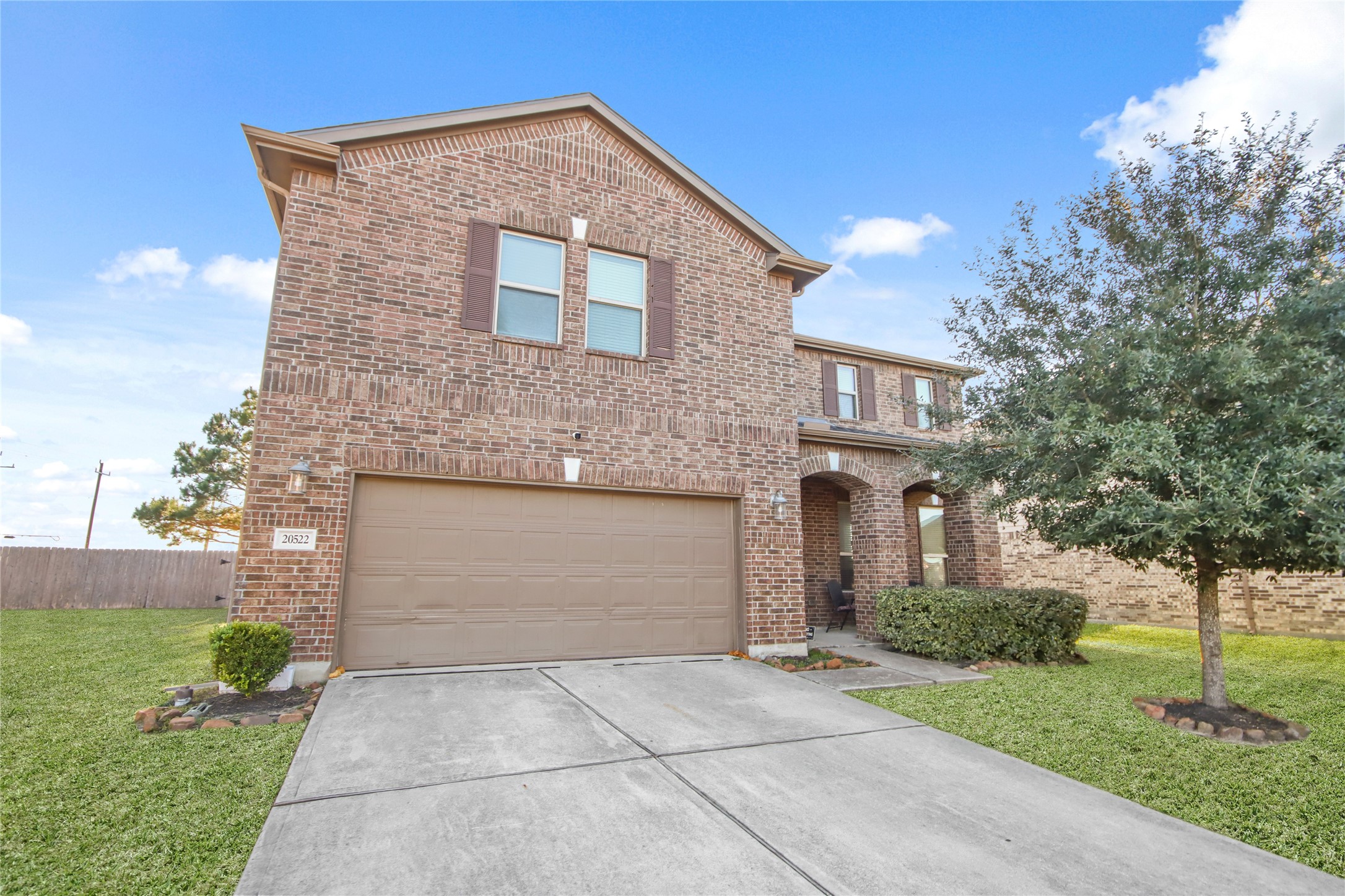 20522 Heath House Drive Porter, TX 77365 - Photo 2 of 16 a front view of a house with a yard and garage