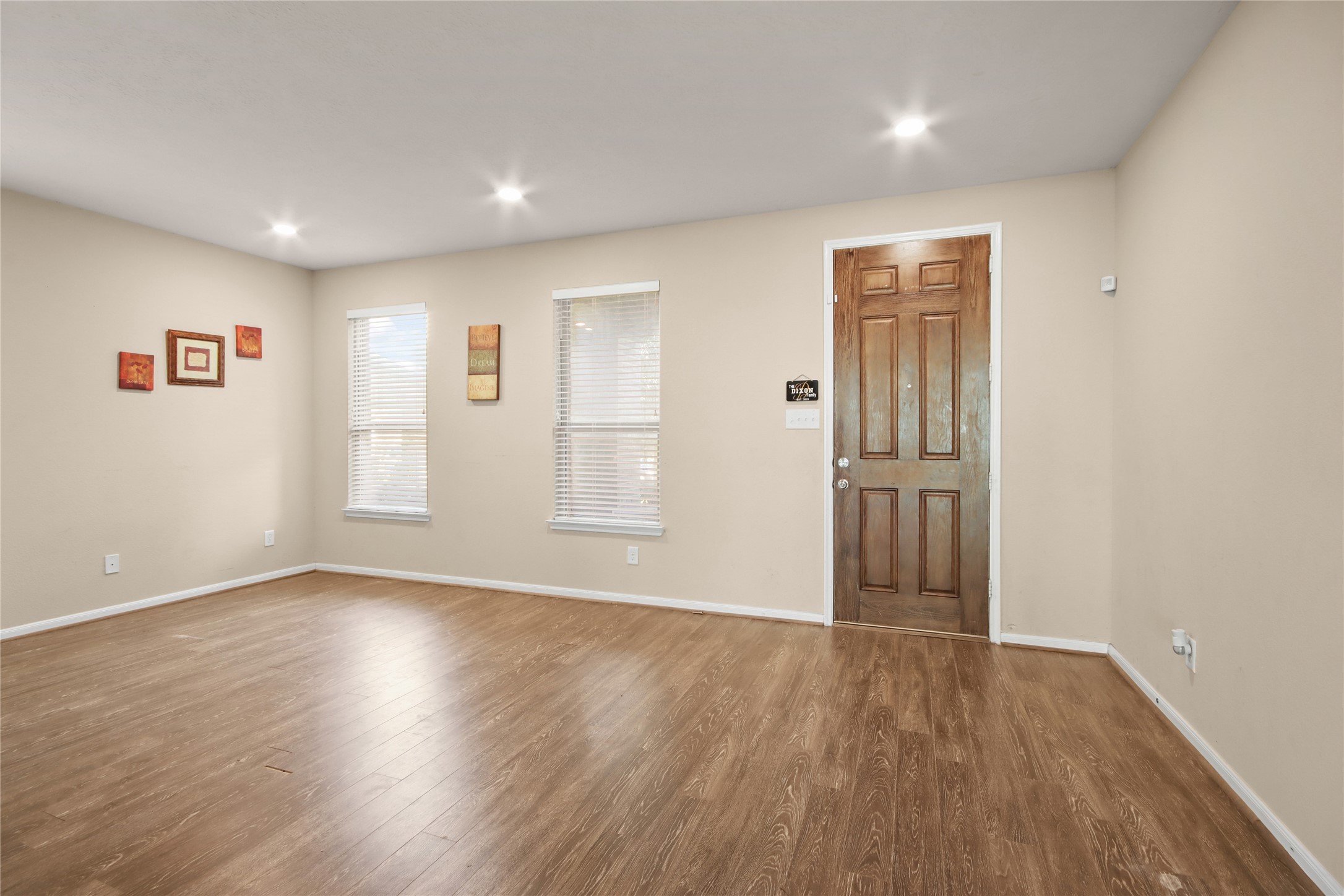 20522 Heath House Drive Porter, TX 77365 - Photo 4 of 16 a view of an empty room with wooden floor and a window