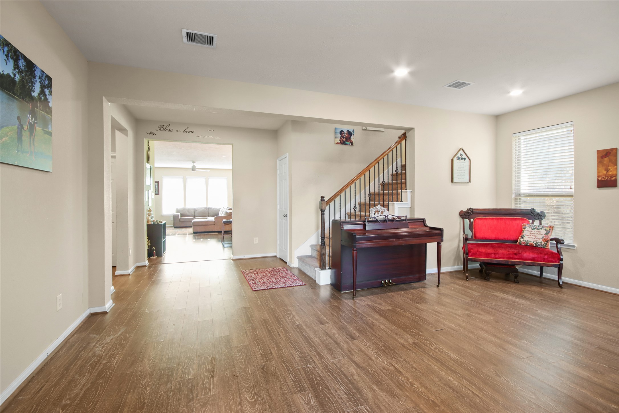 20522 Heath House Drive Porter, TX 77365 - Photo 5 of 16 a living room with furniture and a wooden floor