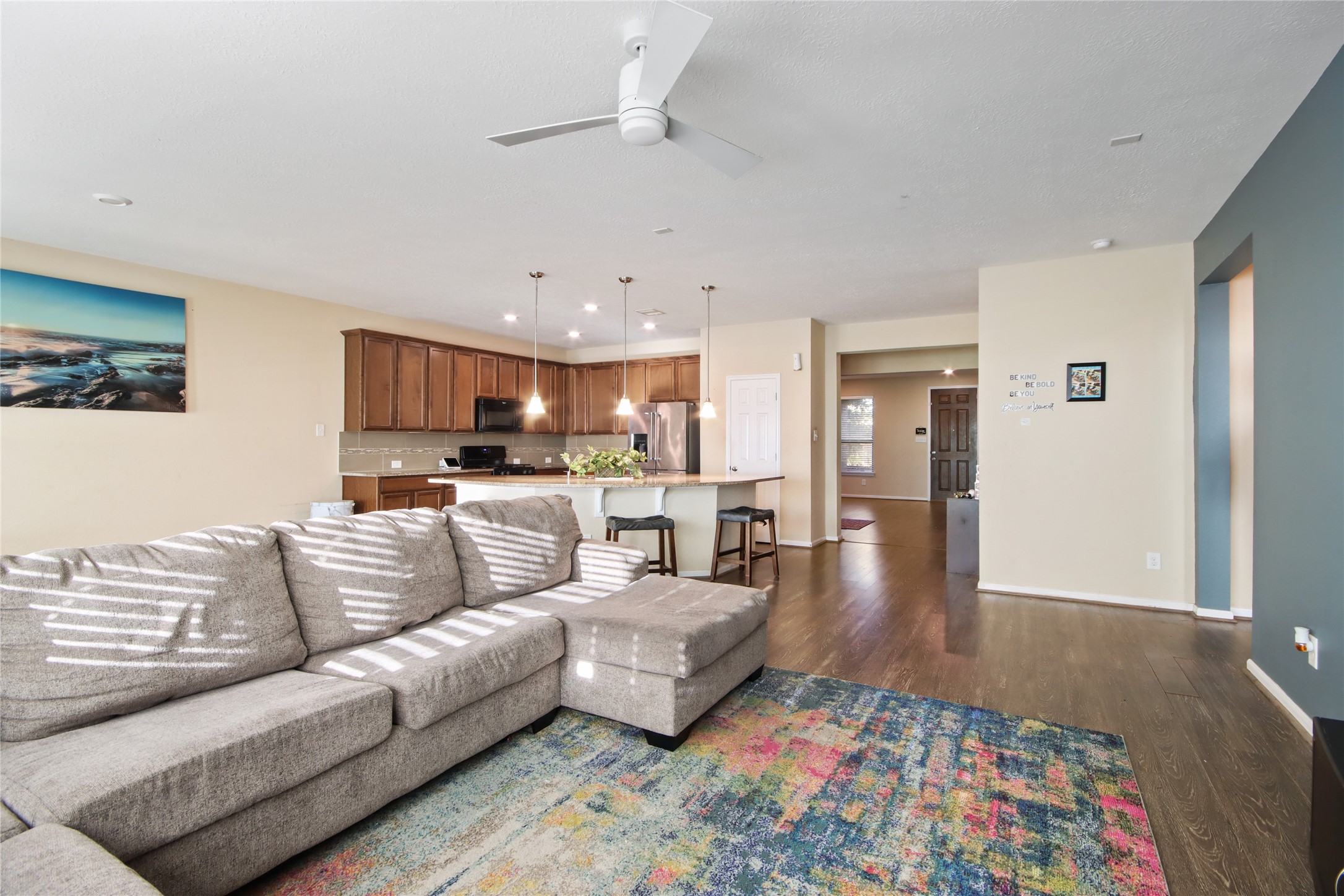 20522 Heath House Drive Porter, TX 77365 - Photo 8 of 16 a living room with furniture and kitchen view