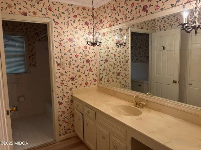 a bathroom with a sink and a mirror