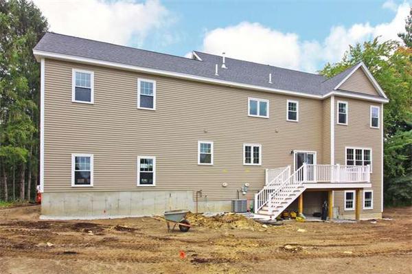 9 Hunt Road Westford, MA 01886 - Photo 17 of 20 a front view of a house with a yard