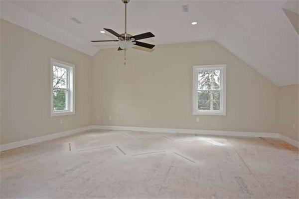 9 Hunt Road Westford, MA 01886 - Photo 7 of 20 an empty room with windows and fan