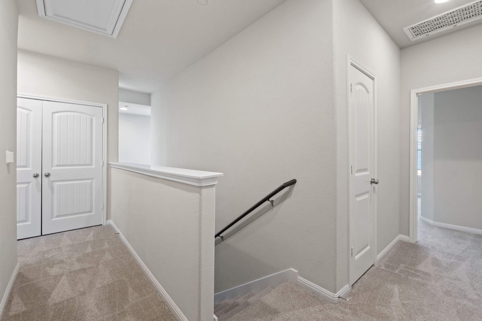 516 East Slaughter Lane, Unit 2001 Austin, TX 78744 - Photo 20 of 31 The property features a hallway with light-colored carpeting and white walls