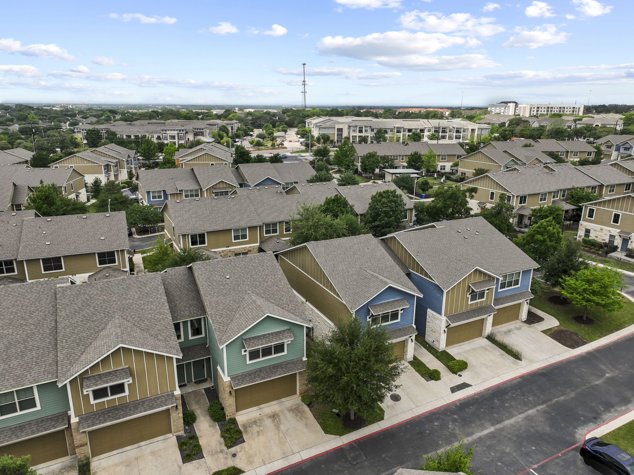 516 East Slaughter Lane, Unit 2001 Austin, TX 78744 - Photo 8 of 31 Aerial view showcasing the property's exterior, surrounded by other residential buildings and green landscaping
