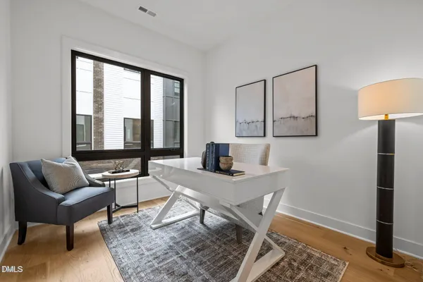 a view of a livingroom with furniture and window