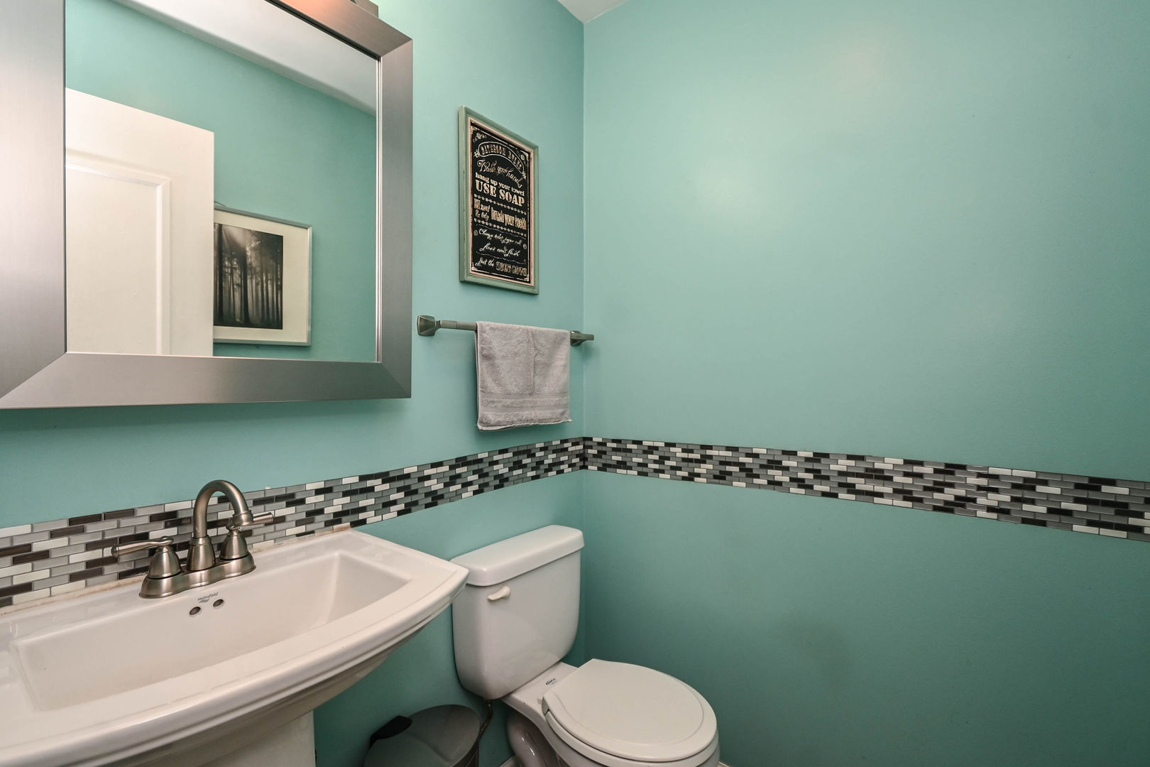 1333 Regency Lane Round Lake, IL 60073 - Photo 21 of 31 a bathroom with a sink mirror and toilet