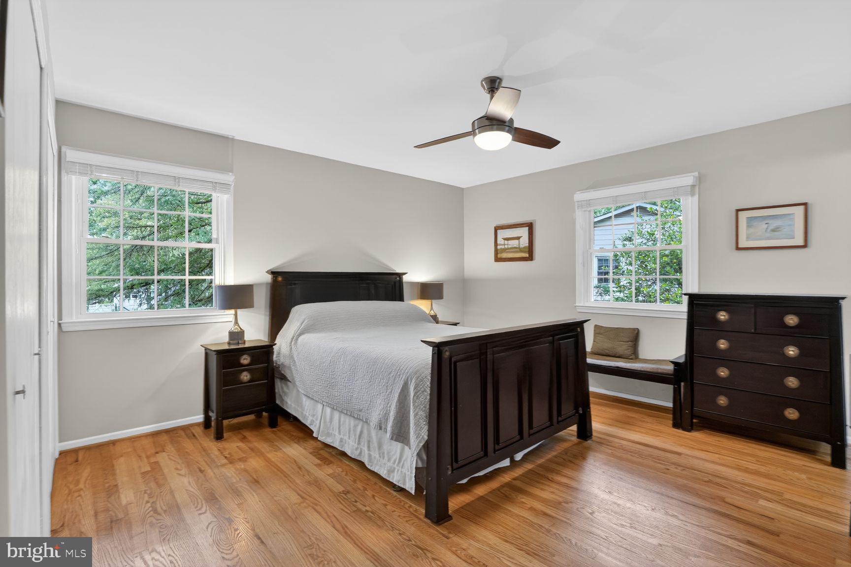 5024 Portsmouth Road Fairfax, VA 22032 - Photo 15 of 38 a bedroom with a bed and a dresser next to a window