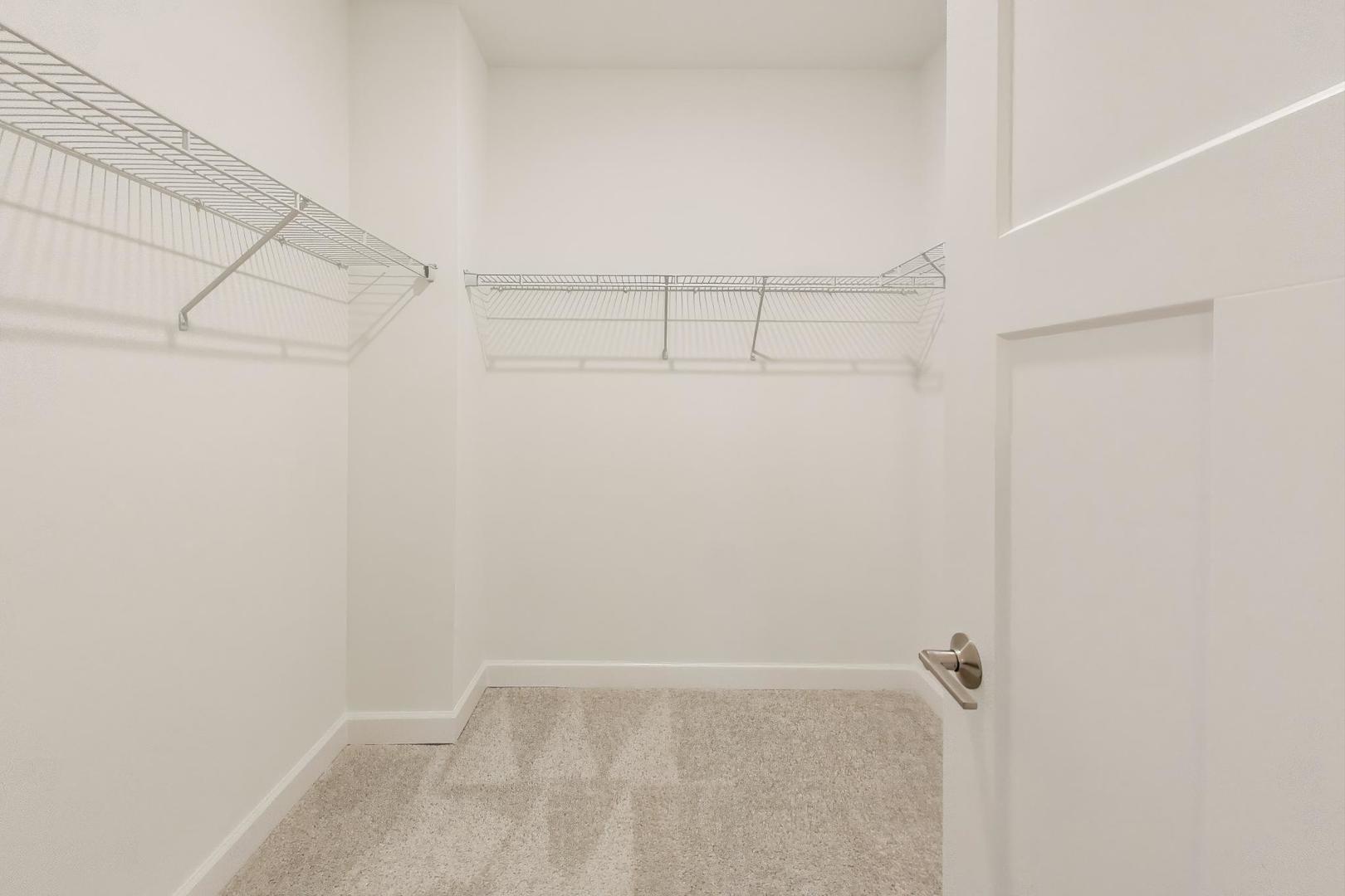 387 Masters Drive Addison, IL 60101 - Photo 14 of 26 a view of a room with racks on the wall