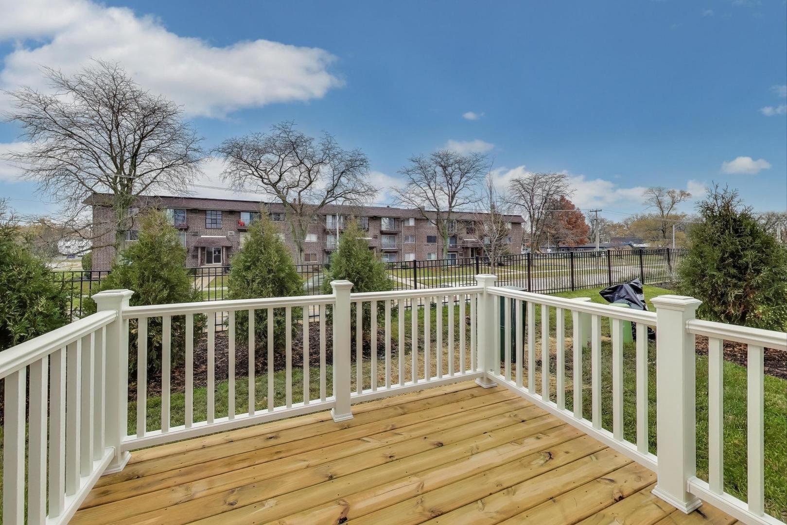 387 Masters Drive Addison, IL 60101 - Photo 20 of 26 a view of a house with a balcony
