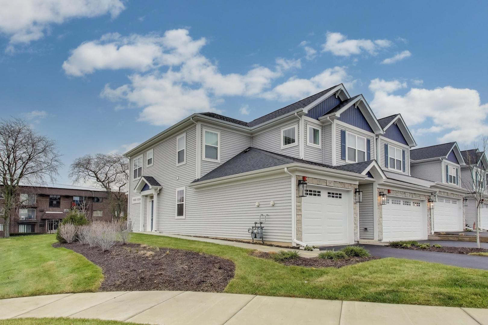 387 Masters Drive Addison, IL 60101 - Photo 2 of 26 front view of a house with a dry yard