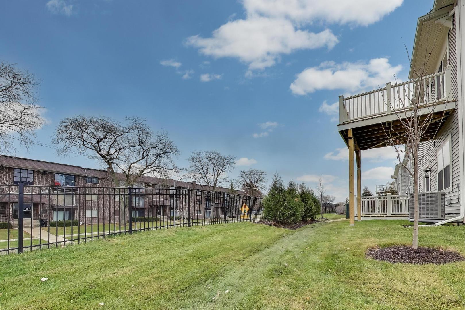 387 Masters Drive Addison, IL 60101 - Photo 21 of 26 a view of a house with a yard