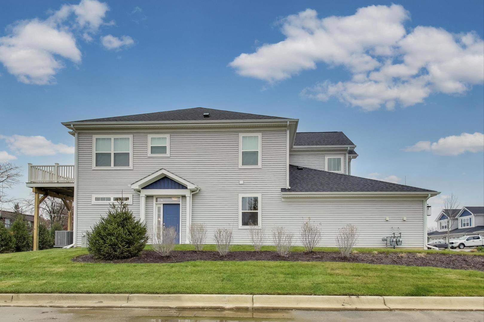 387 Masters Drive Addison, IL 60101 - Photo 23 of 26 a front view of a house with a yard