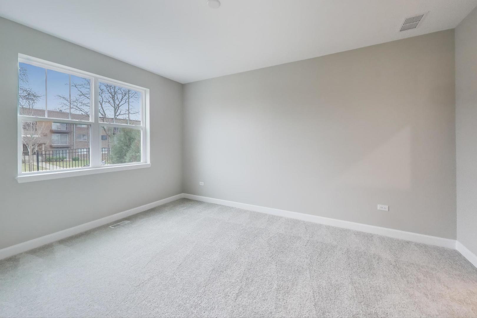 387 Masters Drive Addison, IL 60101 - Photo 10 of 26 a view of an empty room with a window