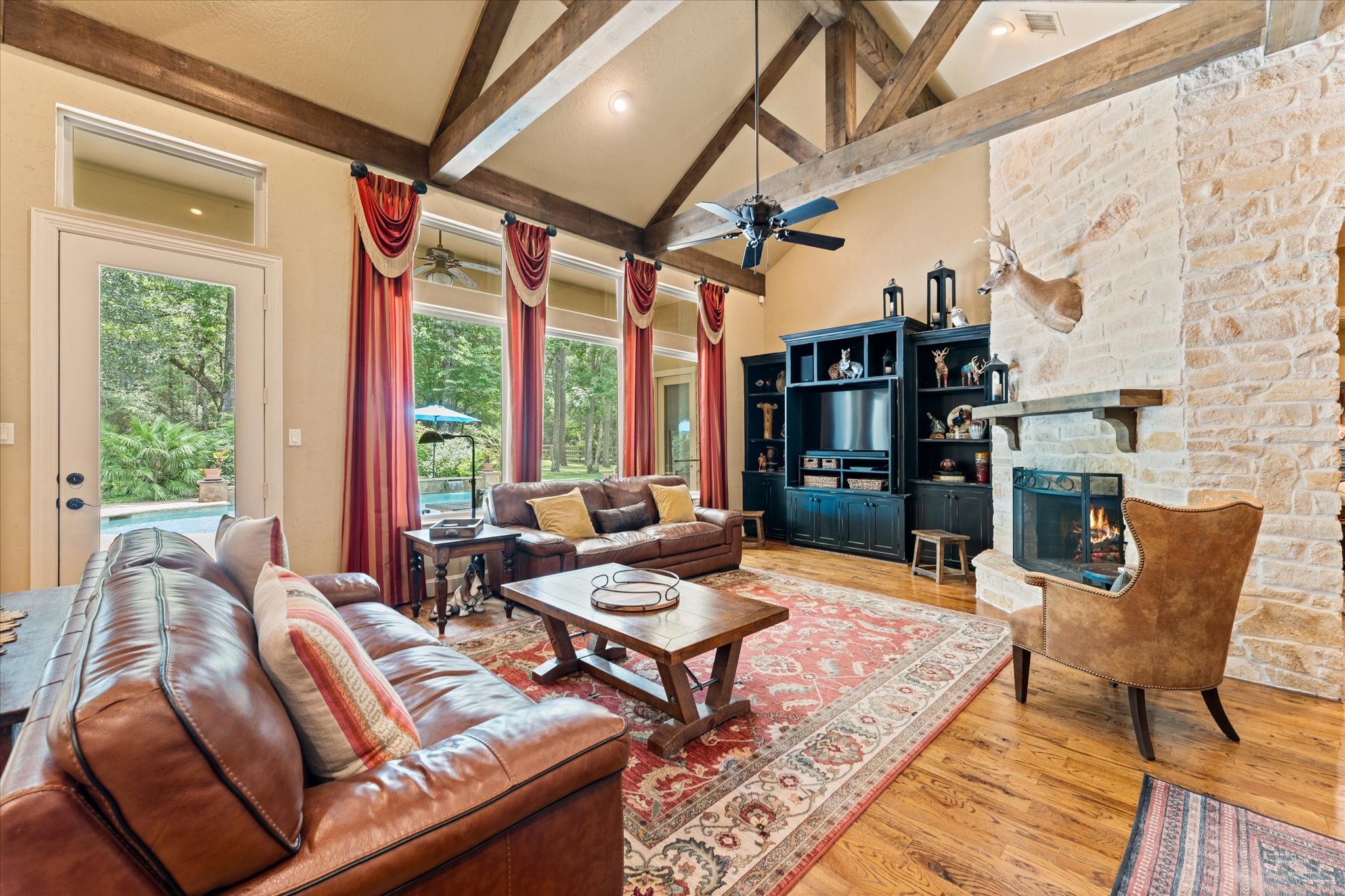 28422 Quiet Way Magnolia, TX 77355 - Photo 8 of 48 Famiy room with floor to ceiling stone fireplace, vaulted beams on ceilings!