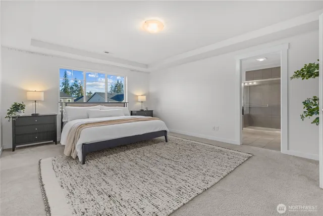 a bedroom with a bed and a dresser