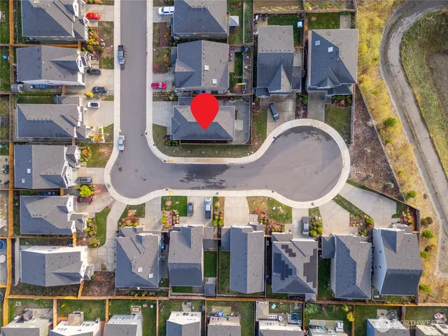 an aerial view of a house with a lake view