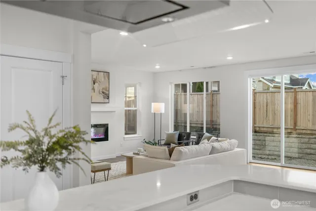 a living room with furniture potted plant and a large mirror