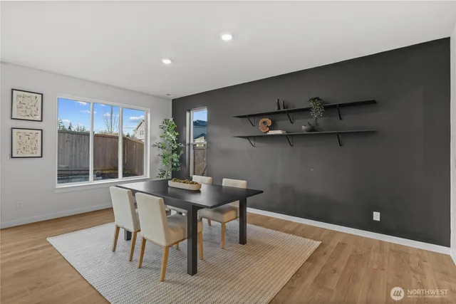 a view of a dining room with furniture and window