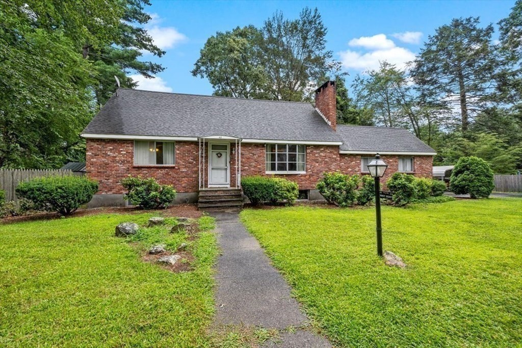 48 Fuller Road Wayland, MA 01778 - Photo 1 of 38 a view of a house with a yard and large tree