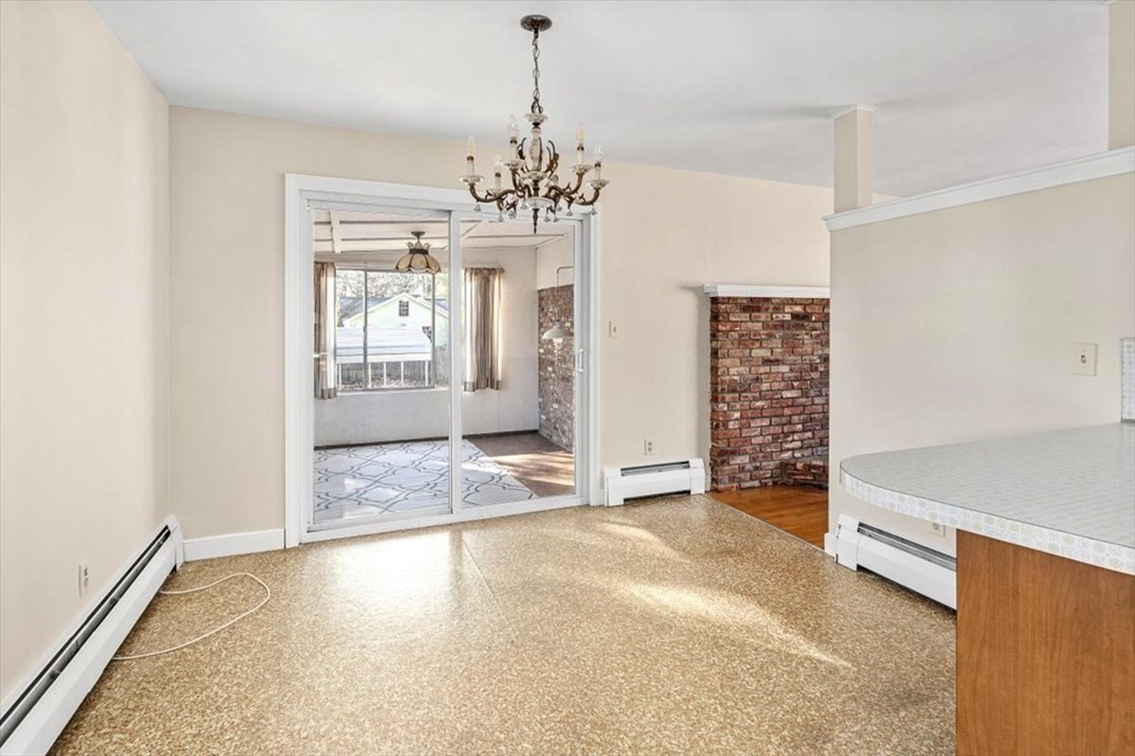 48 Fuller Road Wayland, MA 01778 - Photo 12 of 38 a view of an empty room with kitchen and a window