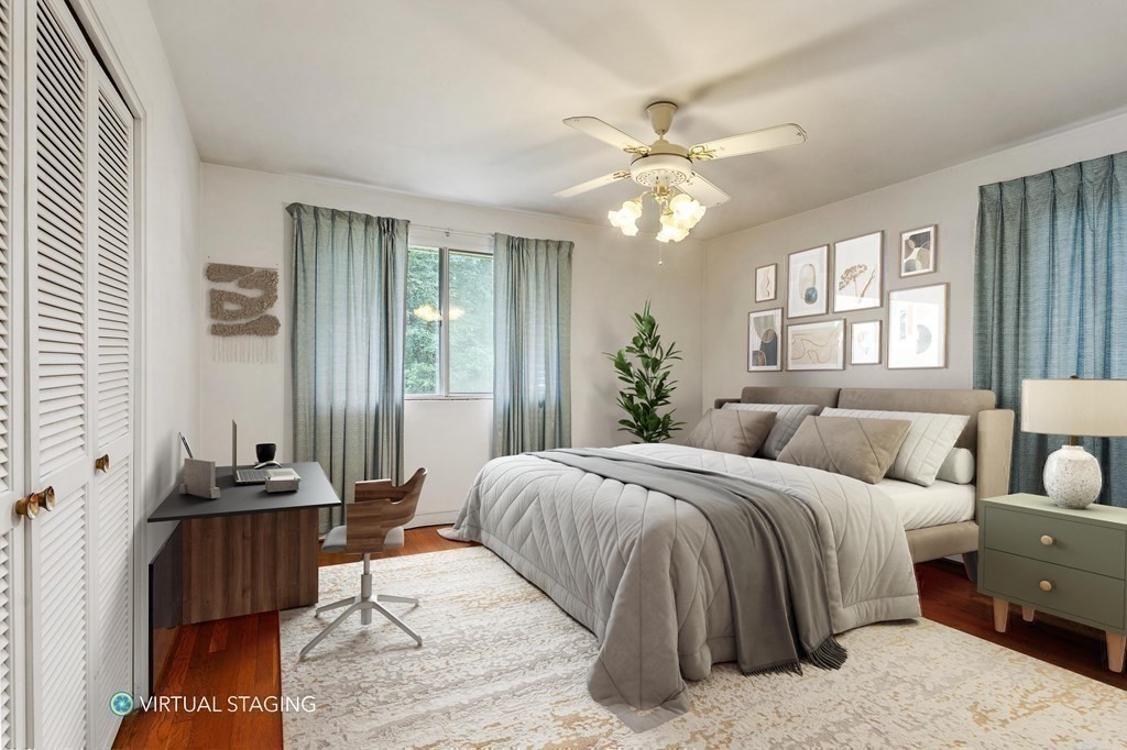 48 Fuller Road Wayland, MA 01778 - Photo 16 of 38 a bedroom with a bed and wooden floor