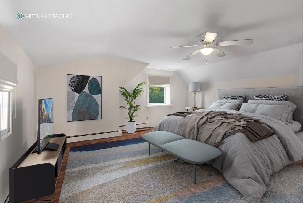 48 Fuller Road Wayland, MA 01778 - Photo 20 of 38 a bedroom with a bed and a chandelier