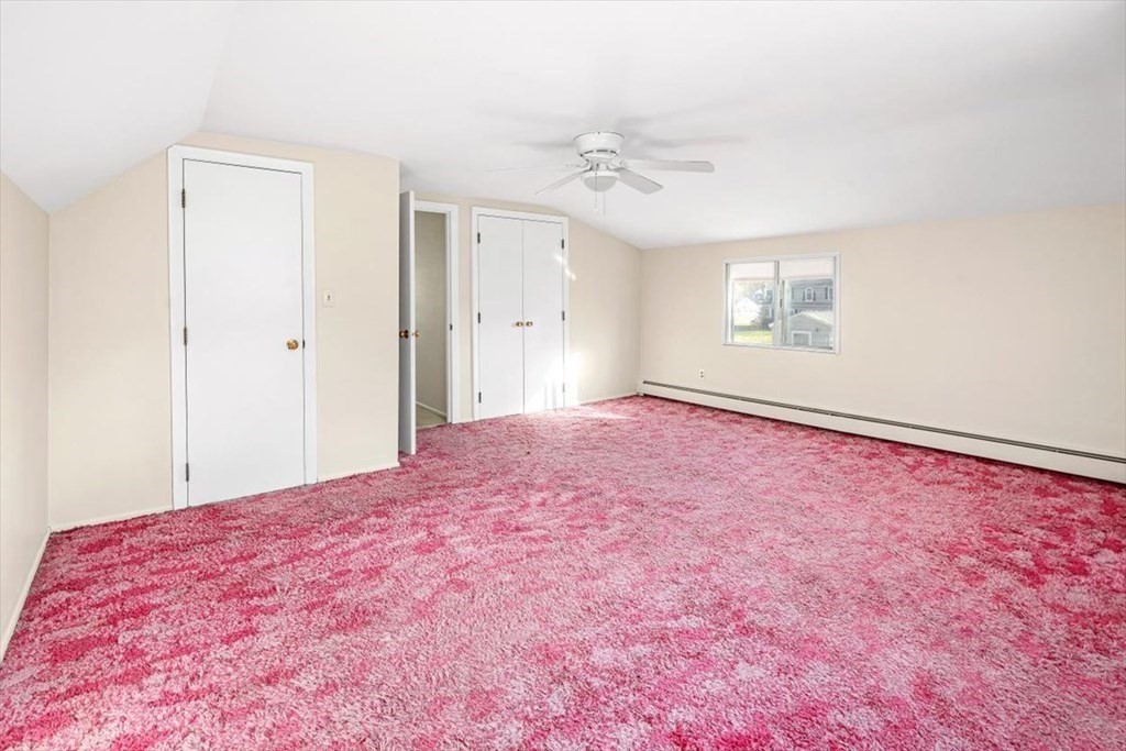 48 Fuller Road Wayland, MA 01778 - Photo 21 of 38 a big room with a chandelier fan and a window