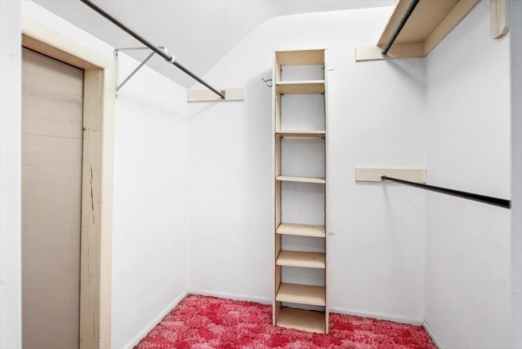 48 Fuller Road Wayland, MA 01778 - Photo 22 of 38 a view of walk in closet with empty racks