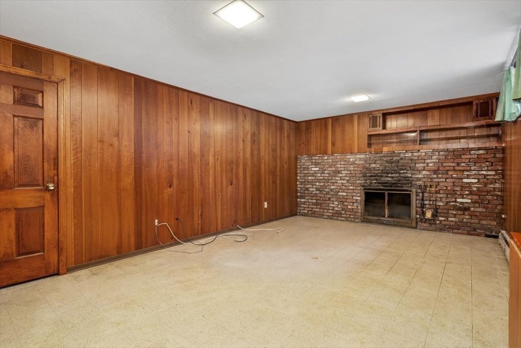 48 Fuller Road Wayland, MA 01778 - Photo 27 of 38 a view of an empty room with a fireplace