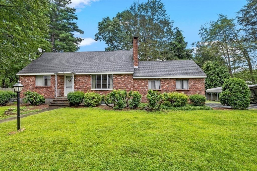48 Fuller Road Wayland, MA 01778 - Photo 35 of 38 a front view of a house with a yard