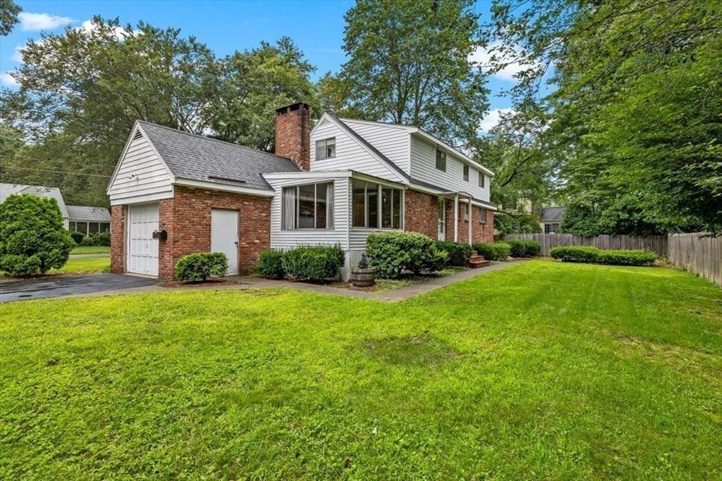 48 Fuller Road Wayland, MA 01778 - Photo 4 of 38 a front view of house with yard and green space