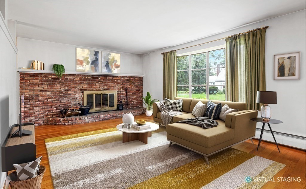 48 Fuller Road Wayland, MA 01778 - Photo 7 of 38 a living room with furniture and a fireplace