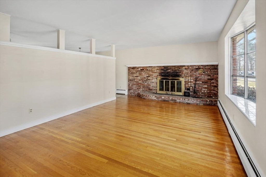 48 Fuller Road Wayland, MA 01778 - Photo 8 of 38 a view of a livingroom with wooden floor