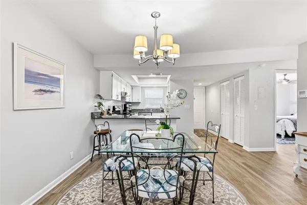 a view of a dining room with furniture and wooden floor
