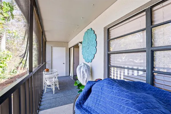 a bedroom with a large bed and flat tv