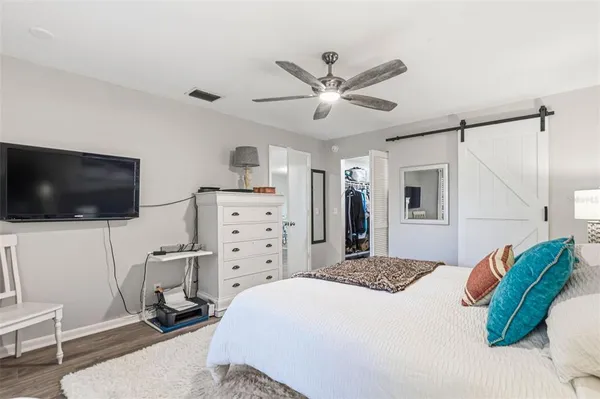 a bedroom with a bed and a dresser