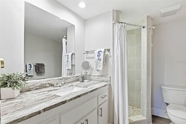 a view of bathroom with washer and dryer