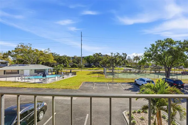 a view of a swimming pool with outdoor seating