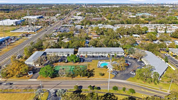 an aerial view of residential houses with outdoor space
