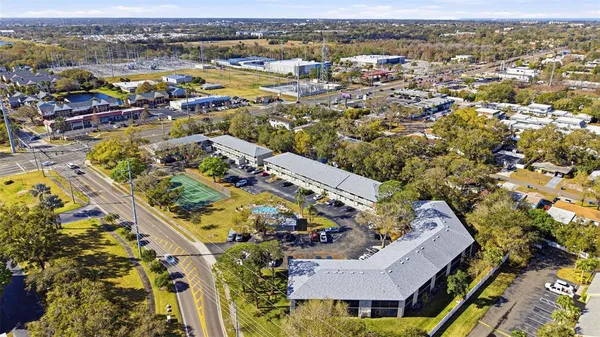 an aerial view of residential houses with outdoor space