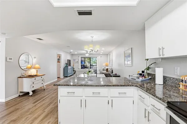 a kitchen with sink and cabinets