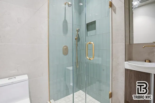 a bathroom with a shower and sink