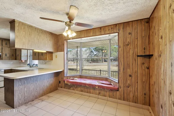 a kitchen with a sink cabinets and appliances